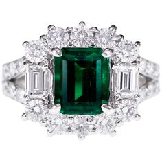 Made in Platinum, this ring consists of 1.99 carat of Vivid Green Colombian Emerald and 1.76 carat of D color VVS quality white brilliant diamonds. The ring has a special certificate of MUZO color. This vividly saturated emerald of 1.99 carats is reminiscent in hue of the varieties displaying the legendary colors found in the world re known MUZO mines. They are also know as the old mine emeralds and are very RARE in nature. Ring size is US 6 and can be resized, Green Platinum Ring With Pavé Setting, Green Platinum Rings With Pave Setting, Gia Certified Luxury Cluster Rings, Luxury Gia Certified Cluster Rings, Luxury Platinum Cluster Emerald Ring, Luxury Cluster Emerald Ring With Prong Setting, Gia Certified Dazzling Cluster Diamond Ring, Formal Platinum Emerald Ring With Pave Setting, Exquisite Diamond Baguette Cut Emerald Ring