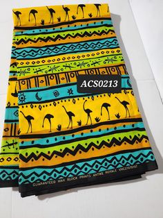 DESCRIPTION Yellow, Black and Green Tribal African Ankara Fabric. This is high quality African print is 100% cotton and it's 45 inches wide. It is used for making African Clothing, African quilts, & For Home decoration. FYI: Print is Double sided. The listing is for 2yards, 6yards and Headwrap For Each piece of fabric measures: 70-72in by 45in for 2yards 105-108in by 45in for 3yards 70in by 22in for Headwrap If you purchase more than one yard, you will receive one continuous piece. *If you requi Traditional Multicolor Cotton Digital Prints, Traditional Black Fabric With Block Print, Traditional Black Block Print Fabric, Black Fabric With Traditional Patterns, Bohemian Cotton Fabric For Festivals, Traditional Patterned Cotton Digital Prints, Traditional Black Fabric With Traditional Patterns, Multicolor Cotton Digital Prints For Festivals, Cotton Multicolor Digital Prints For Festivals