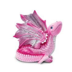 a pink dragon figurine sitting on top of a white surface