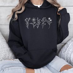 Available In Unisex Xs, S, M, L, Xl, And Xxl. Just Place An Order And Message Your Size After! Wildflowers Hoodie Embrace The Beauty Of Nature With Our ""Wildflowers Hoodie""! This Stylish Hoodie Features A Charming Vintage Wildflower Design, Perfect For Botanical Lovers And Those Who Appreciate Floral Aesthetics. Made From Soft, Comfortable Fabric, It's An Ideal Gift For Moms, Especially On Mother's Day, Or Anyone Who Loves A Trendy Yet Cozy Look. The Spacious Kangaroo Pocket And Adjustable Dra Floral Aesthetics, Flower Hoodie, Wildflower Design, Flower Sweatshirt, Mom Sweater, Floral Hoodie, Gifts For New Moms, Personalized Shirts, Gift For Mom