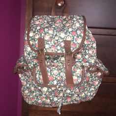 Floral Backpack With Drawstring And Double Snap Closure. Has Three Outer Pockets That Also Snap Shut. Two Inner Pockets And A Zipper Compartment. Adjustable Straps. Looks Brand New, Perfect Condition. Casual Cream Backpack With Adjustable Strap, Casual Cream Satchel Backpack, Casual Beige Backpack For Spring, Floral Backpack, Drawstring Bag, Drawstring Backpack, Snap Closure, Adjustable Straps, High School