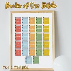 a printable book of the bible is displayed on a wall next to a lamp