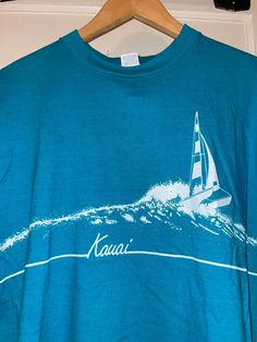 Great preowned condition Crazy Shirt. Graphics in good condition, some slight cracking. The shirt isn't yet as thin as it could be. Needs more wear/wash. Sailboat Racing, Shirt Graphics, Kauai Hawaii, Weird Shirts, Green Turquoise, Kauai, San Diego, Hawaii, Graphic Tees