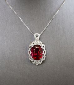 "Royal Rubellite Red Tourmaline and Diamond Necklace in 18k White Gold, 21ct Natural Red Tourmaline Statement Pendant, Luxury Jewelry Gift Welcome to true, luxury jewelry. This is perhaps our most extravagant handcrafted piece to date, featuring a natural cushion shaped rubellite tourmaline from Brazil. The stone has a red hue with hints of peachy pink depending on the viewing angle. The stone is untreated and weighs 21.02ct. We've set it securely with double claw prongs in a diamond-rich Art De Luxury Red Jewelry With Gemstone Accents, Luxury Jewelry With Lab-created Ruby Gemstone, Luxury Lab-created Ruby Gemstone Jewelry, Luxury Ruby Necklace With Gemstone Accents, Exquisite Red Oval Necklace, Luxury Ruby Necklaces With Gemstone Accents, Exquisite Red Oval Necklaces, Formal Red Lab-created Ruby Necklaces, Luxury Ruby Oval Pendant Jewelry