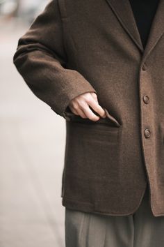 A modern wool blazer, created to add a sprinkle of sophistication to any look. This timeless piece is designed with an oversized fit and thoughtful details. Features an asymmetrical notched lapel and adaptable collar, unique drop-capped details on the shoulder and three-button closure. Tuckable front flap pockets and side slits. Fully lined.

Color: Brown
100% Wool; Lining: 100% Cotton Business Casual Wool Tweed Jacket With Pressed Crease, Business Casual Wool Tweed Jacket, Fall Wool Suit With Suit Collar, Wool Suit With Suit Collar For Fall, Winter Business Casual Tweed Jacket With Pressed Crease, Wool Suits For Fall, Wool Suits With Suit Collar For Fall, Fall Wool Suits, Fall Formal Blazer With Welt Pockets