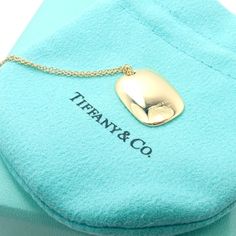 About This Piece: Metal: 18k Yellow Gold Pendant Size: 16mm x 20mm Weight: 8.7 grams Length: 15.5" Total, 15" Chain Hallmarks: Tiffany & Co Elsa Peretti 750 Spain 3017aed Formal Gold-plated Necklace With Rectangular Pendant, Gold Plated Rectangular Pendant Necklace For Formal Occasions, Designer Yellow Gold Necklace With Polished Finish, Designer Yellow Gold Necklaces With Polished Finish, Designer Yellow Gold Polished Necklace, Designer Gold Necklace With Polished Finish, Gold Plated Necklace With Rectangular Pendant For Formal Occasions, Luxury Yellow Gold Oblong Jewelry, Luxury Gold-plated Necklace With Rectangular Pendant