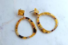 Beautiful tortoise shell hoop earrings with studs measuring approx 2". Giftbox included! Elegant Tortoiseshell Hoop Earrings, Trendy Adjustable Tortoiseshell Jewelry, Elegant Tortoiseshell Round Hoop Earrings, Tortoiseshell Round Earrings For Gift, Round Tortoiseshell Earrings For Gift, Tortoiseshell Hoop Earrings For Gift, Trendy Tortoiseshell Jewelry Gift, Elegant Tortoiseshell Hoop Earrings For Gift, Trendy Tortoiseshell Jewelry For Gifts