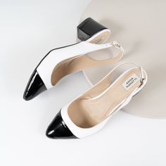 "Ella - beautiful sling-back block heels, classic model black & white. The insole made of a soft calfskin ensures comfort of use. Slim sole and delicately pointed toes optically slim feet.  Love at first look.... Whatever your style, I can guarantee that pumps will suit your look and add a final touch of polish. The sling-back pumps look just as good with casual jeans, dress or evening outfit.  BRAND: Anna Maratti  MATERIAL: white grain leather and black patent leather LINING: calf leather SOLE: synthetic FIT: regular width HEELS HEIGHT:  5 cm = 2\"   Sizes US, EU, UK and feet dimensions 5 US / 36 EU / 3 UK insoles length 23.5 cm = 9.2 inches 6 US / 37 EU/ 4 UK insoles length 24 cm = 9.5 inches 7 US / 38 EU / 5 UK insoles length 24.5 cm = 9.7 inches 8 US/ 39 EU/ 6 UK insoles length 25.5 cm White Slingback Pumps For Work, Formal Black Slingback Pumps With Rubber Heel Cap, Chic Black Slingback Pumps With Rubber Heel Cap, Black Slingback Sandals With Contrasting Heel, White Block Heel Slingback Pumps For Work, White Closed Toe Slingback Pumps For Work, Chic Black Slingback Block Heels, Elegant Slingback Pumps With Block Heel, White Ankle Strap Slingback Sandals For Work