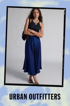 Flowing Kimchi Blue midi skirt in an updated drop-waist silhouette. Designed in satin featuring a mid-rise waistline, v-drop waist with button detailing and a floaty, a-line skirt. Finished with an asymmetric hemline for added movement. Only at Urban Outfitters. Features Kimchi Blue Vanessa drop waist midi skirt Asymmetric midi skirt Satin fabric with subtle sheen Mid-rise waistline V-shape drop waist with button detailing Floaty skirt with asymmetrical hem A-line fit Midi length UO exclusive Content + Care 100% Polyester Machine wash Imported Size + Fit Model in Blue is 5’9" and wearing size Small Measurements taken from size Small Length: 32.5" | Kimchi Blue Vanessa Drop Waist Midi Skirt in Blue, Women's at Urban Outfitters