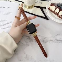 Luxury Slim Leather Apple Watch Band Elevate your Apple Watch with our genuine leather band designed for series 8, 7, 6, 5, 4, 3, and SE. This slim bracelet offers a touch of elegance and comfort, available in 38mm, 40mm, 41mm, 42mm, 44mm, 45mm, and 49mm sizes. Crafted with precision, this band combines functionality with style. The premium leather ensures durability and a luxurious feel against your skin. It's the perfect accessory for both formal occasions and everyday wear. With easy installa Trendy Leather Strap Apple Watch Band, Trendy Brown Leather Strap Watch Bands, Trendy Brown Watch Band With Bracelet Strap, Trendy Rectangular Apple Watch Band With Leather Strap, Trendy Brown Bracelet Strap Watch Band, Trendy Gold Leather Watch, Luxury Brown Bracelet Strap Apple Watch Band, Gold Leather Apple Watch Band With Bracelet Strap, Luxury Brown Apple Watch Bracelet Strap