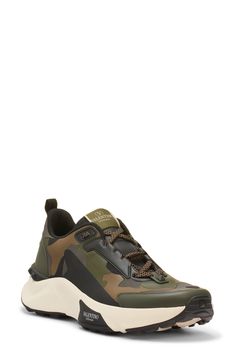 Tessellated camo and a hiker-inspired silhouette add rugged touches to a streetwear-essential sneaker detailed with signature logo accents at the tongue and sidewall. Lace-up style Removable insole Leather and textile upper/textile lining/synthetic sole Made in Italy Designer Shoes Low-top Outdoor Sneakers With Logo Print, Sporty Sneakers With Logo Print For Outdoor, Sporty Outdoor Sneakers With Logo Print, Camouflage Lace-up Sneakers For Streetwear, Sporty Camouflage Sneakers For Sports, Camouflage High-top Sneakers With Rubber Sole, Camouflage Sneakers With Round Toe For Outdoor, Camouflage Sneakers For Outdoor With Round Toe, Sporty Camouflage Sneakers For Outdoor