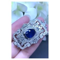 An exclusive Brooch/Pendant in Art Deco design, so elegant and refined, a very piece of art. Brooch/Pendant come in 18k gold , with a natural Royal Blue Ceylon Sapphire, in perfect oval cut , extra fine quality, of 6,76 carats, and 148 pieces of sparkly natural diamonds of 3,70 carats, F/ VS clarity , in round and baguettes cut. This piece you can use as a brooch and as a pendant, so you have two jewels in one piece. It is a piece of high jewelry. Handcrafted by artisan goldsmith. Excellent manu Luxury Ceremonial Pendant Brooches, Luxury Diamond Pendant Brooch, Luxury Blue Jewelry Brooch, Luxury Elegant Sapphire Brooch, Luxury Blue Fine Jewelry Brooches, Ceylon Sapphire, Diamond Brooch, Royals, Art Deco Design