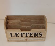 a wooden box that has letters on it