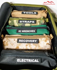 the contents of an army duffel bag are labeled with tools straps and wrenches