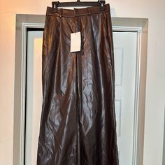 Faux Leather. Brown Faux Leather Wide-leg Pants For Night Out, Wide-leg Faux Leather Pants For Night Out, Wide Leg Faux Leather Pants For Date Night, Date Night Wide Leg Faux Leather Pants, Wide Leg Leather Pants For Going Out, Faux Leather Wide Leg Pants For Going Out, Fall Wide Leg Leather Pants For Date Night, Wide Leg Leather Pants For Fall Date Night, Wide Leg Faux Leather Pants For Going Out