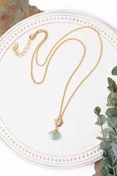 Indulge in the radiance of Dreams & Flowers with our beautifully crafted aquamarine focal necklace. An elegant addition to any outfit. Matte Gold Plated Brass (lead and nickel free) Aquamarine 24.5-26.5", adjustable with matte gold plated brass lobster claw clasp We hand select our natural materials, thus there may be slight variations in color and/or size that will not detract from the overall aesthetic Our unique handcrafted designer jewelry for women is made in America, with each design creat Elegant Amazonite Jewelry Gift, Elegant Amazonite Jewelry For Gifts, Elegant Adjustable Emerald Gemstone Necklace, Elegant Adjustable Emerald Necklace Gift, Elegant Amazonite Necklace For Gift, Gold Aquamarine Pendant Necklace, Elegant Nickel-free Necklace For May Birthstone, Elegant Nickel Free Necklace For May Birthstone, Elegant Adjustable Turquoise Necklace