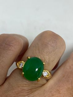 Vintage Lucky Green Nephrite Jade ring Fun jade is color enhanced Large green nephrite jade Ornate German Gold finished Vintage ring, does not tarnish, NOT sterling Size 5.75, 7, 7.5 or 9 All rings are shipped free in the US in a nice gift box. Check out our over a THOUSAND great reviews!!! Engraving is $4 per letter and is not always perfect depending on the piece. It can take a few days if the jeweler is busy. This is payable to Paypal Judithsltd@gmail.com This is "fun jade" Color enhanced sto Green Emerald Oval Cabochon Ring, Green Emerald Ring With Oval Cabochon, Green Emerald Cabochon Rings, Green Emerald Cabochon Ring For Anniversary, Green Onyx Oval Ring, Green Cabochon Emerald Ring For Anniversary, Green Oval Cabochon Ring For Anniversary, Green Cabochon Emerald Ring For May Birthstone, Green Chrysoprase Cabochon Rings