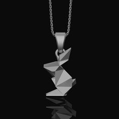 Origami Rabbit Charm Necklace - Elegant Silver Pendant, Chic Folded Bunny Design, Perfect Artistic Gift for Her Experience the whimsy of origami art with our Origami Rabbit Necklace. This charming pendant features a delicately folded Silver Rabbit, a symbol of grace and playfulness. The Folded Bunny Charm captures the essence of origami craftsmanship, while the Chic Bunny Pendant adds a touch of modern elegance. Whether you're looking for a thoughtful Gift for Her, appreciate unique origami designs, or simply adore rabbits, this necklace is a perfect choice. It's more than just an accessory; it's a celebration of art, elegance, and the joyful spirit of the rabbit. Wear it proudly and carry the enchanting essence of the origami rabbit with you wherever you go. ✦ Jewelry Details ✦ • Material Origami Rabbit, Unique Origami, Bunny Pendant, Rabbit Necklace, Grace Symbol, Rabbit Charm, Rabbit Necklaces, Bunny Design, Thoughtful Gifts For Her