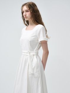 This product is designed with versatility in mind, featuring a 2-way sleeve that allows for multiple styling options. The inclusion of a belt accentuates the waistline, providing a flattering silhouette to this belted dress. Its mid-length hem offers a classic and sophisticated look, suitable for various occasions. - The dress comes with a detachable belt to cinch the waist for a tailored fit.- Puff sleeves can be worn two ways, adding a touch of elegance and adaptability.- Crafted with a subtle A-line cut that gracefully complements the figure.- Complete with a concealed back zipper for a seamless look and easy wear. A Line Cut, 2 Way, Belted Dress, Dress White, Easy Wear, Puff Sleeves, Mid Length, Puff Sleeve, The Dress