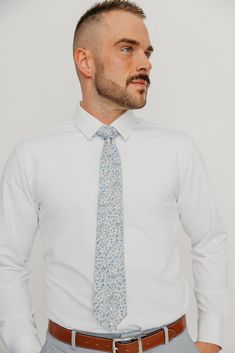 We pride ourselves in offering our customers some of the best skinny ties money can buy. Each DAZI tie is handmade from high quality imported fabrics. Features: Approx. 2.5" wide at the tip Approx. 58" in length 100% Cotton Dapper Standard Tie, Dapper Fitted Tie, Dapper Fitted Standard Tie, Cotton Ties For Workwear In Spring, Fitted Cotton Suit And Tie Accessories, Formal Cotton Tie, Spring Business Cotton Suit And Tie Accessories, Spring Cotton Ties For Black Tie Events, Dapper Formal Ties For Spring