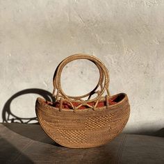 The Bali Rattan Boat Clutch is the perfect accessory for any stylish woman. This beautiful, handmade rattan bag is made by skilled artisans in Bali, using natural materials to create a one-of-a-kind piece that is both fashionable and functional. The boat-shaped design adds a unique touch to the classic rattan style, making it the perfect bag for a night out or any special occasion. With its versatile size and beautiful design, the Bali Rattan Boat Clutch is sure to impress. Shop now and add a to Rattan Style, Well Woven, Rattan Bag, Coconut Shell, Buy Handmade, Perfect Bag, Cotton Bag, Fashion Handbags, Cleaning Clothes