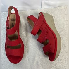 Clark’s Womens Soft Cushion Wedge Leather Suede Adjustable Straps Red Sandals Size 7 New Without Box See Pictures For Details. 2.5 Inch Wedge Red Wedge Sandals With Removable Insole And Round Toe, Casual Synthetic Wedge Sandals With Red Sole, Synthetic Wedge Sandals With Red Sole And Open Toe, Red Leather Wedge Sandals, Slip-on Wedge Sandals With Red Sole, Red Synthetic Platform Wedge Sandals, Leather Wedge Sandals With Red Sole, Red Closed Toe Synthetic Wedge Sandals, Red Synthetic Closed Toe Wedge Sandals