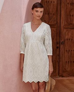 An effortlessly feminine dress to take you from day to date night, in soft cotton with allover embroidered eyelet detail for artful interest, plus a well-placed lining for just-right coverage. The flattering flyaway silhouette is enhanced with a V-neckline, front and back seaming, and a scalloped hem. Elegant A-line Mini Dress With Floral Embroidery, Spring A-line Dress With Cutwork Hem, Elegant Embroidered V-neck Midi Dress, Chic Lace Dress With Broderie Anglaise, Elegant Spring Embroidered Cocktail Dress, Elegant Spring Cocktail Embroidered Dress, Elegant V-neck Lace Dress For Brunch, Spring A-line Dress With Embroidered Hem, Feminine Lace Dress With Broderie Anglaise