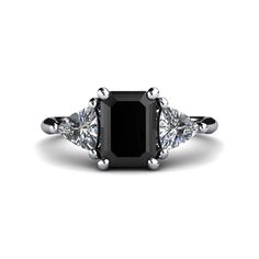 a black diamond ring with three diamonds on the sides and an oval center stone in the middle