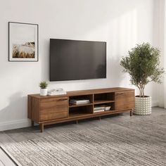 a large flat screen tv mounted to the side of a wooden entertainment center in a living room