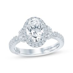 an oval cut engagement ring with diamond shoulders