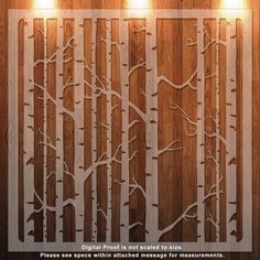 a wooden wall with some lights hanging from it's sides and trees in the middle