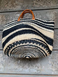 "Etra Large Kiondo shopping bag,sisal bag, storage bag, Home organizing bag,Sisal kiondo basket, Black and white kiondo bag. The bag is great for your day out shopping or at the beach. Can also be used for your home organization and storage. Dimensions Top 30\" Height 15\" Base lenght 12\" wide Ready to ship Thank you so much for shopping with us!" Black Large Capacity Basket Bag, Black Large Capacity Basket Shoulder Bag, Large Capacity Black Basket Shoulder Bag, Black Basket Bag With Large Capacity, Black Basket Shoulder Bag With Large Capacity, Natural Color Basket Bag For Market, Black Basket Bucket Bag With Leather Handles, Large Capacity Black Bag For Market, Natural Top Handle Beach Bag For Market