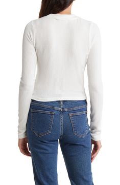 Refresh your essentials with this long-sleeve crop top cut from a stretchy ribbed knit. 18 1/2" length Crewneck Long sleeves 97% polyester, 3% spandex Machine wash, tumble dry Made in the USA Model stats: 5'10" height, 32" bust, 25" waist, 36" hip. Model is wearing size Small. White Stretch Cropped Sweater, Stretch Long Sleeve Cropped Sweater With Ribbed Neckline, Stretch Cropped Sweater With Ribbed Neckline And Long Sleeves, Trendy Cropped Sweater With Ribbed Neckline For Spring, White Stretch Cropped Sweater Trendy, White Stretch Cropped Sweater Trendy Style, Trendy White Stretch Cropped Sweater, Trendy Ribbed Long Sleeve Top For Spring, Ribbed Long Sleeve Stretch Crop Top