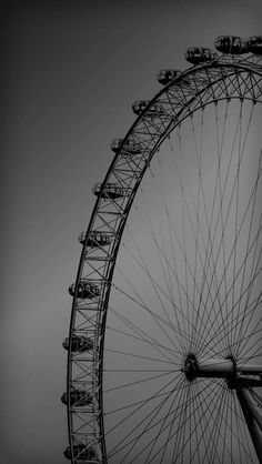 the large ferris wheel is in black and white