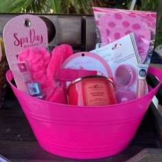 a pink bucket filled with lots of items