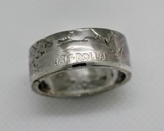 a silver ring with the word haff doula engraved on it