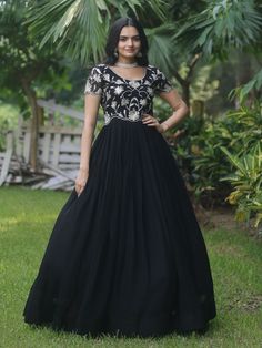 Introducing our stunning "black embroidered georgette reception wear gown" that is sure to make you stand out at any event or function. This black gown features exquisite sequin and embroidered work, adding a touch of elegance and glamour to your look. Crafted from high-quality georgette fabric, this gown is the perfect choice for those special occasions when you want to look and feel your best.
This black reception wear gown is that it comes fully stitched, saving you the hassle of alterations Evening Lehenga With Resham Embroidery In Maxi Length, Semi-stitched Embellished Black Anarkali Set, Black Georgette Party Dress, Evening Lehenga With Zari Work, Maxi Length, Formal Floor-length Lehenga With Mirror Work, Floor-length Georgette Gown With Intricate Embroidery, Intricate Embroidery Floor-length Georgette Gown, Formal Floor-length Sequined Lehenga, Formal Embellished Maxi Length Lehenga