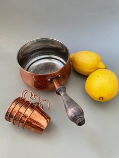 Vintage copper pot / saucer and 5 small copper cups (shot glass). Wooden handle for pot. Kitchen display decor. Vintage Scandinavian copperware. Storage pot.  In vintage good condition - small scratches and patina, interior lining in good condition. Please see pictures!  Size:  12 cm / 4'7 inches wide  8 cm / 3 inches high  24 cm / 9'4 inches long including handle cup is 5 cm / 2 inches wide and 3,5 cm / 1'3 inches high # packages are sent with tracking number (for combined orders, please contac Vintage Copper Pots, Scandinavian Rustic, Copper Cups, Shot Cups, Cooking Supplies, Kitchen Display, Vintage Scandinavian, Rustic Kitchen Decor, Copper Pots