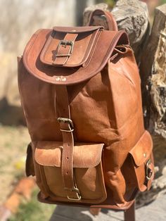 Handmade Goat Leather Backpack Rucksack Bag Material : : Goat leather : Cotton canvas : zipper :Brass Buckles Dimension: 16" Length x 8" Width x 8" Height (In Inches)  18" Length x 8.5" Width x 8.5" Height (In Inches)  20" Length x 10" Width x 10" Height (In Inches)  Outer: : Handle on top carry : Detachable and adjustable back  shoulder strap/ side strap : 4 small pockets Inner: 1 Big compartments inside 1 small zipper pocket thank you for visiting and if you have any question feel free to cont Vintage Leather Travel Backpack, Large Capacity Leather Duffle Bag Backpack, Brown Leather Backpack Duffle Bag, Brown Large Capacity Backpack For Travel, Leather Travel Bag With Large Capacity, Large Capacity Leather Backpack In Brown, Brown Leather Lined Backpack For Travel, Casual Leather Backpack Travel Bag, Travel Brown Leather Lined Backpack