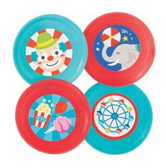 four frisbees with circus designs on them are shown in three different colors