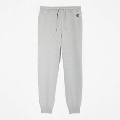 These men's tracksuit bottoms are made in a cotton/polyester blend, providing the comfort and breathability of cotton with the crisp finish of polyester. These sweatpants have a casual style, adjustable drawstring in the waistband, and ribbed ankle cuffs..83% cotton, 17% polyester Ribbed cuffs Ribbed waistband with drawstring Embroidered Timberland® tree logo on the hip Two-pocket style Regular fit Cotton Drawstring Sweats For Jogging, Gray Cotton Joggers With Drawstring, Cotton Drawstring Joggers Sportswear, Gray Cotton Joggers For Leisure, Cotton Drawstring Sweatpants Sportswear, Sports Cotton Joggers With Drawstring, Gray Cotton Sweatpants For Jogging, Gray Cotton Sweats For Jogging, Tree Logo