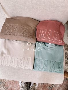 "Neutral Embroidered MAMA Lightweight Sweatshirt This cozy fleece lined sweatshirt makes a great gift for any mama or mama to be! Color: Tan, Dust, Mauve, Dusty Blue (see photos for colors shown) Fit: Unisex, Fits loose/relaxed (SEE SIZE GUIDE IN PHOTOS) Sizing: S,M,L,XL Material: ringspun 50% Cotton, 50% Polyester *this is a LIGHTWEIGHT sweatshirt; it is not thick* Font of the embroidery will be as pictured & all letters will be automatically capitalized (this cannot be changed).  Thread color for embroidery will have more of a monochromatic look to match the color sweatshirt. *Thread color CANNOT be changed* This item has LIMITED customization requests You may request customization within these limits: -ONLY ONE WORD -Must be a short word like (MAMA, DADA, AUNTIE, WIFE, WIFEY, BRIDE, BAB Cozy Long Sleeve Tops With Letter Embroidery, Cozy Long Sleeve Sweatshirt With Letter Embroidery, Cozy Cotton Sweatshirt With Embroidered Text, Relaxed Fit Sweater With Letter Embroidery For Loungewear, Loungewear Sweater With Letter Embroidery And Relaxed Fit, Winter Loungewear Tops With Letter Embroidery, Cotton Loungewear Sweater With Embroidered Text, Embroidered Text Sweatshirt For Loungewear, Loungewear Sweatshirt With Embroidered Text