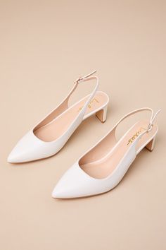 You'll instantly make any ensemble more sophisticated when you style it with the Lulus Bastienne White Pointed-Toe Slingback Pumps! Dress any look up with these smooth faux leather pumps that start with a classy pointed-toe upper that carries into a slender slingback strap that secures with a shiny gold buckle. A low blade heel lends an ultra-stylish finish to the chic design! 2. 25" blade heel. Lightly cushioned insole. Rubber sole has nonskid markings. All Man Made Materials. Imported. Lulus | Elegant Faux Leather Slingback Pumps For Formal Occasions, Elegant Formal Faux Leather Slingback Pumps, Elegant Synthetic Slingback Sandals With 4-inch Heel, Elegant Faux Leather Slingback Pumps, Formal Faux Leather Slingback Pumps, Chic Synthetic Slingback Pumps With Block Heel, Elegant Summer Slingback Pumps In Faux Leather, Elegant Synthetic Slingback Pumps For Office, Elegant Faux Leather Slingback Pumps For Summer