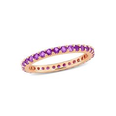 a pink gold ring with purple stones