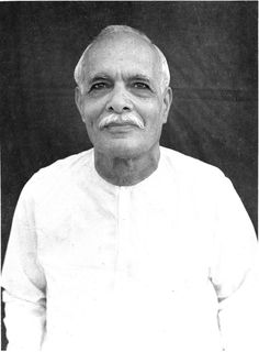 an old photo of a man in white