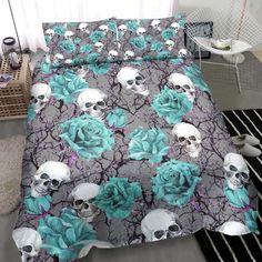 a bed with skulls and flowers on it