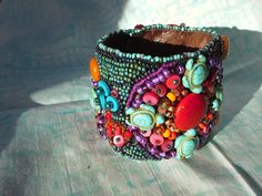 Beautiful hand beaded cuff bracelet made with an assortment of seed and other novelty beads and backed with Ultrasuede . Fits a 7"wrist with snap closures. Can be custom made to order. Handmade Multicolor Cuff Bracelet Wearable Art, Multicolor Handmade Cuff Bracelet - Wearable Art, Multicolor Handmade Cuff Bracelet Wearable Art, Unique Colorful Beaded Cuff Bracelet For Festivals, Eclectic Beaded Festival Bracelets, Unique Festival Cuff Bracelet With Colorful Beads, Unique Cuff Bracelet With Round Beads For Festivals, Handmade Multicolor Cuff Bracelet, Unique Handmade Multicolor Cuff Bracelet