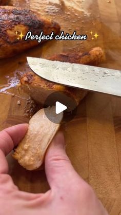 a person is cutting chicken with a knife