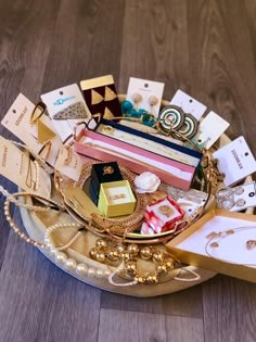 a basket filled with lots of different types of jewelry