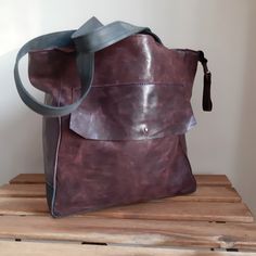 Aubergine large leather bag for women. Leather with a light texture, shaded. This is a natural nubuck leather. Handles navy blue. On the backe exterior zip pocket. Large outside pocket on the front. The bag is closed with a zipper. Zippered, inside lining,and zip pocket and 2 on phones. The bottom of the double leather. Big :) Height of 30 cm, the overall width of 46 cm at the top. Handles 55 cm. I send all bags by UPS courier. The bag goes to the USA about 7 days, in Europe it takes about 5 day Purple Leather Tote Shoulder Bag, Modern Purple Leather Shoulder Bag, Modern Purple Leather Satchel, Purple Soft Leather Bag, Purple Leather Hobo Bag For Travel, Purple Leather Satchel, Soft Leather Purple Shoulder Bag, Purple Soft Leather Shoulder Bag, Purple Leather Hobo Tote Bag